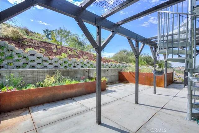 a view of a swimming pool with a patio