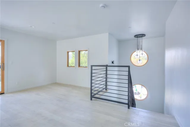 a view of entryway with stairs and wooden floor