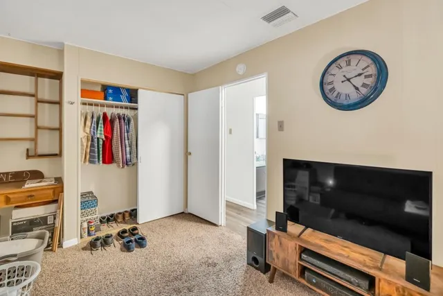 a bathroom with a sink vanity granite and toilet
