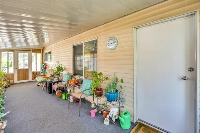 a room with furniture and a large window