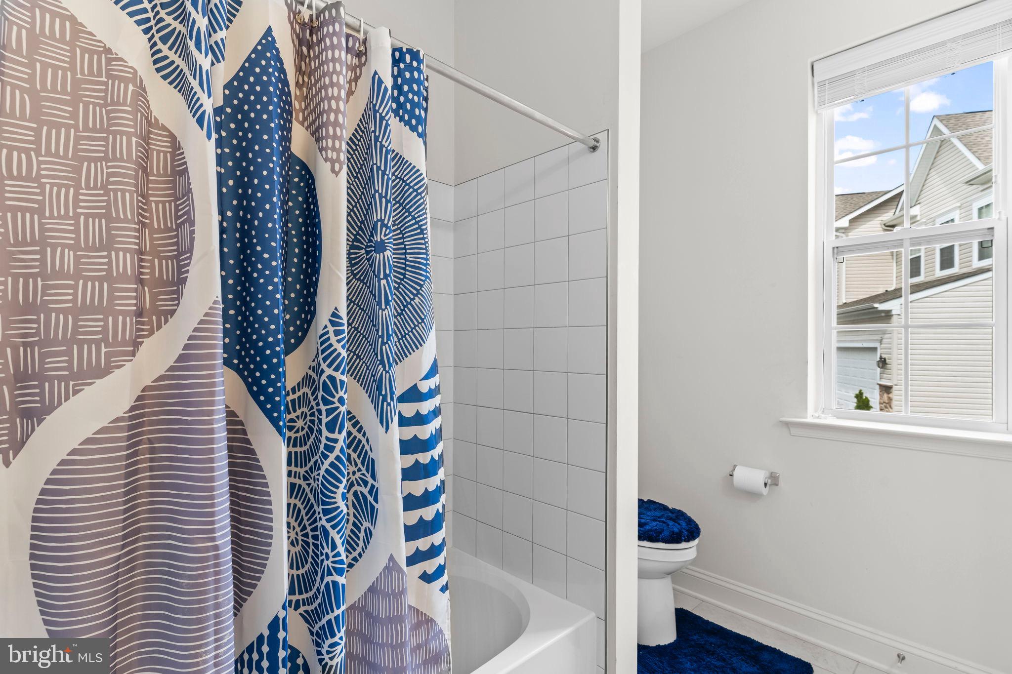 9104 Rama Court Clinton, MD 20735 - Photo 13 of 62 Bright and airy hall bathroom with modern decor.