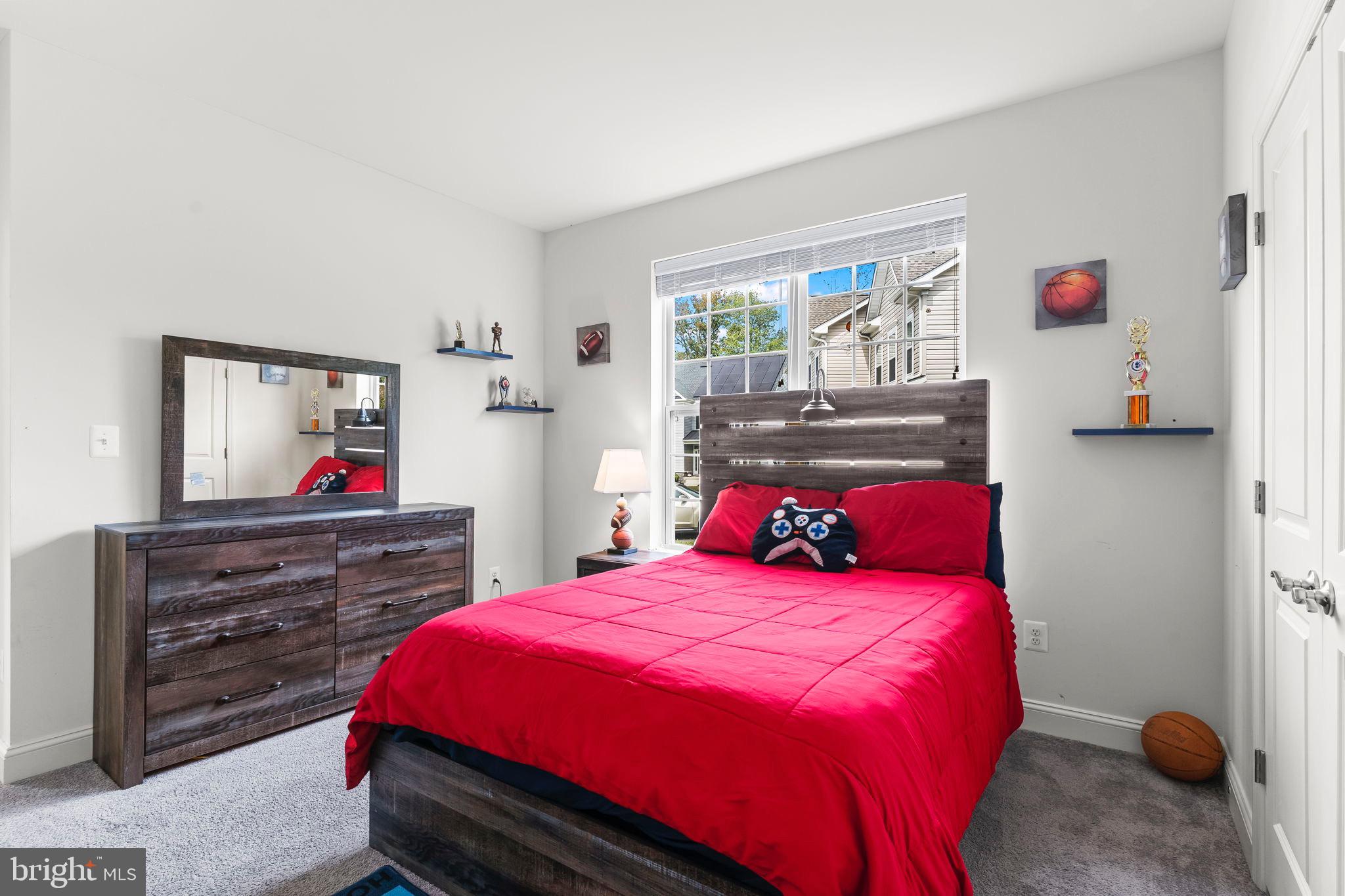 9104 Rama Court Clinton, MD 20735 - Photo 16 of 62 Cozy bedroom with vibrant red accents.