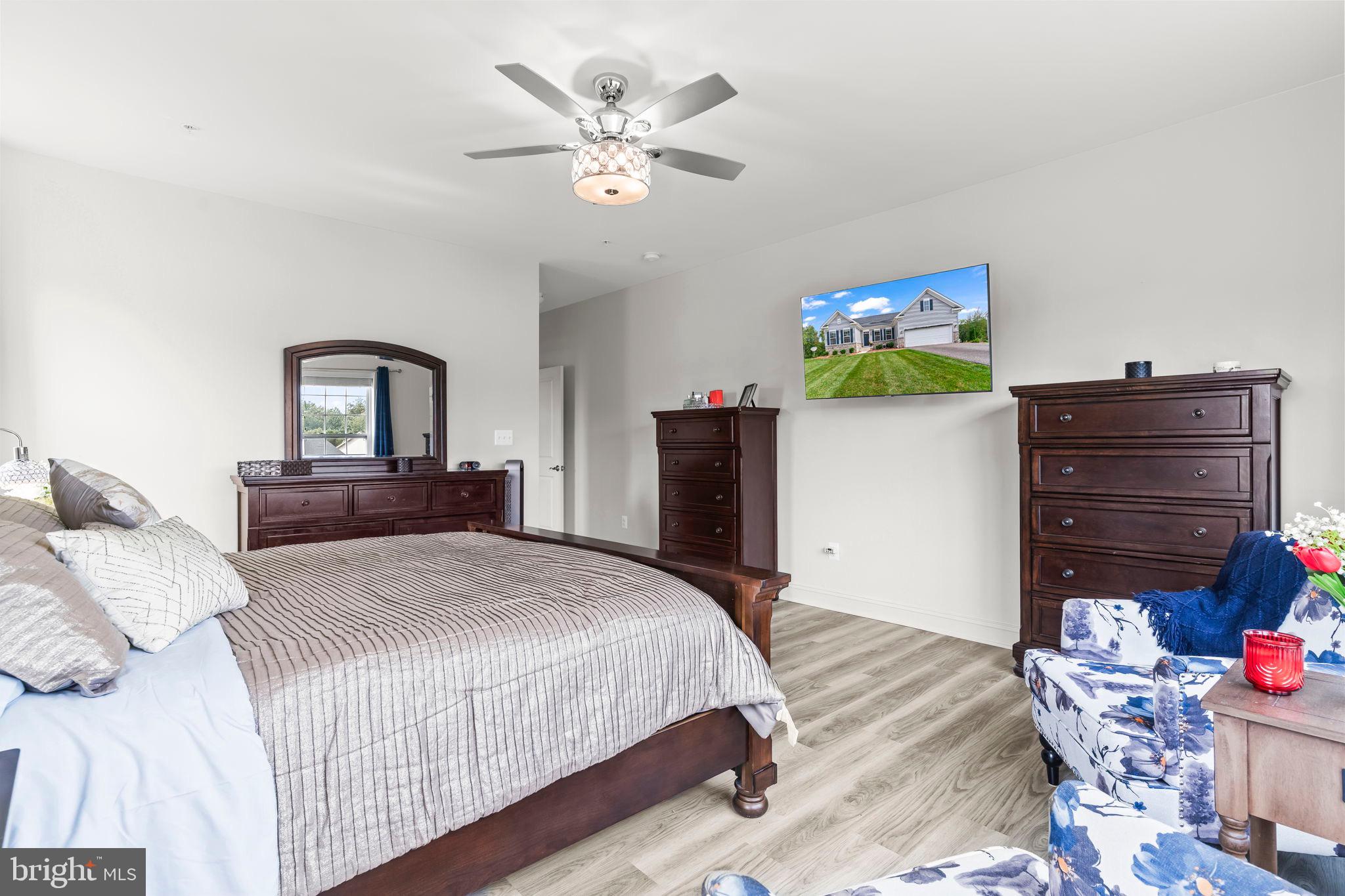 9104 Rama Court Clinton, MD 20735 - Photo 18 of 62 Modern bedroom with stylish decor and light.
