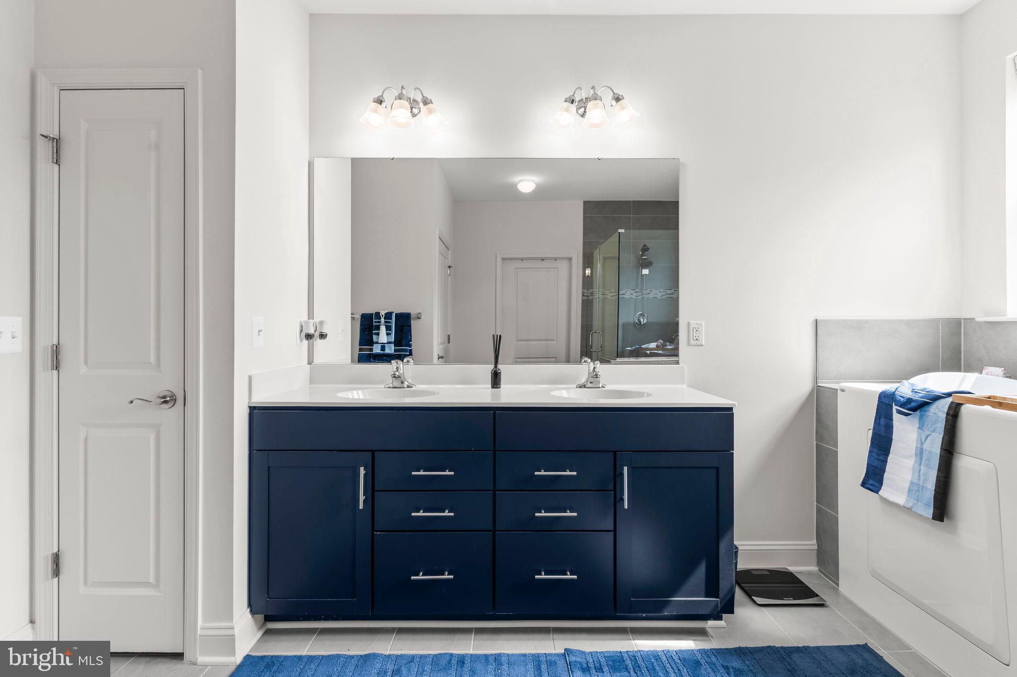 9104 Rama Court Clinton, MD 20735 - Photo 20 of 62 Sleek modern hall bathroom with elegant finishes.