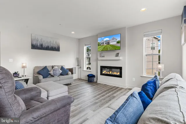 a kitchen with stainless steel appliances granite countertop sink stove top oven and cabinets