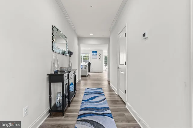 a view of a workspace with furniture and wooden floor