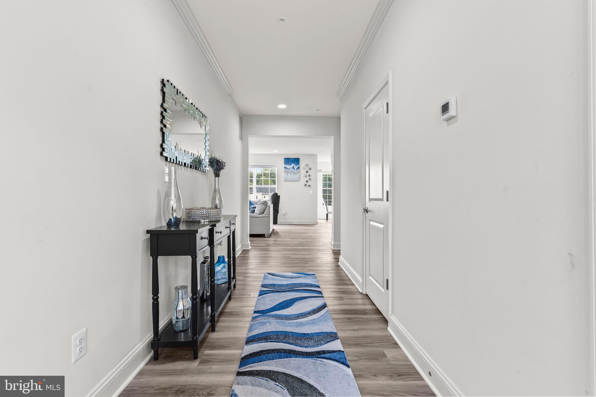 9104 Rama Court Clinton, MD 20735 - Photo 4 of 62 Inviting hallway with coastal charm.