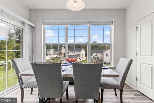 a view of a livingroom with furniture and a window