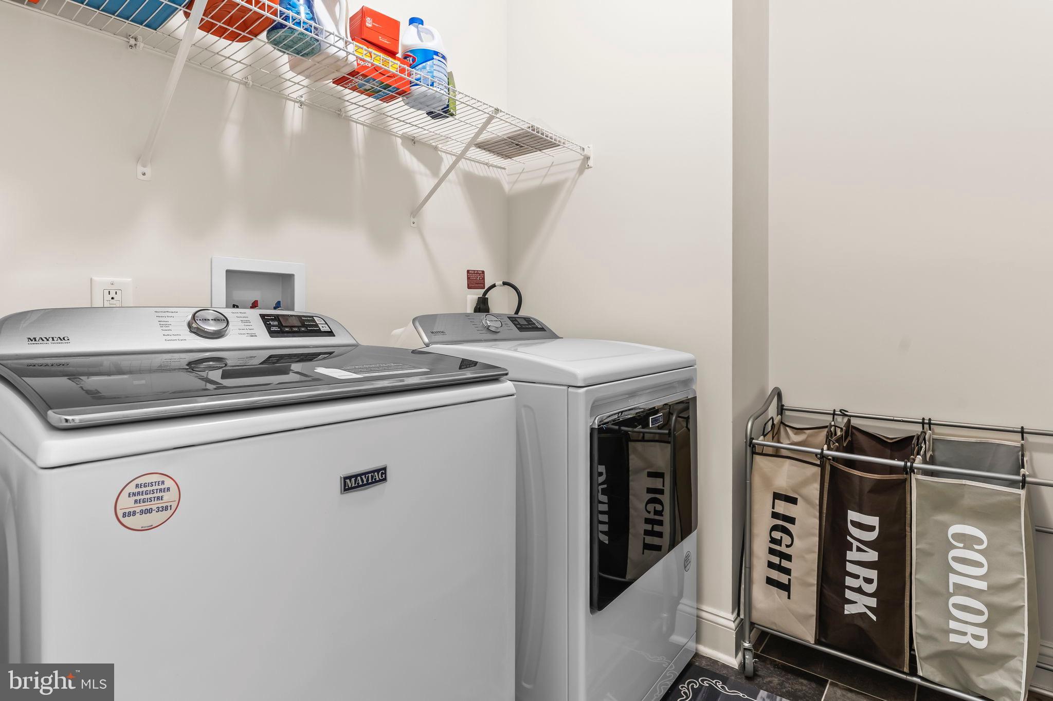 9104 Rama Court Clinton, MD 20735 - Photo 45 of 62 Modern laundry space with organized storage.