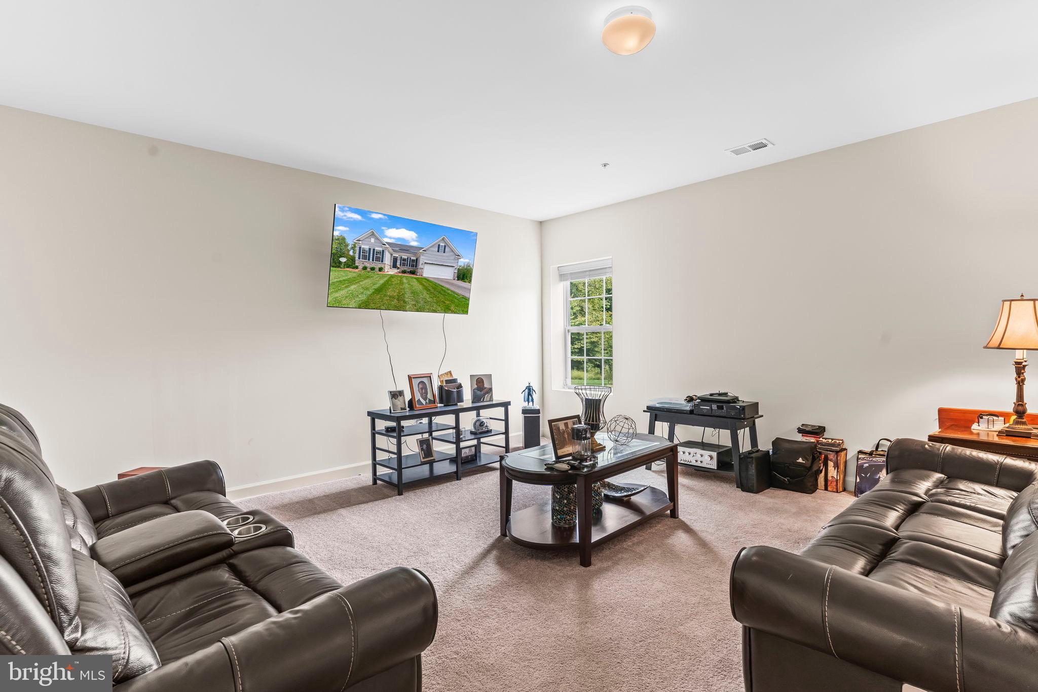 9104 Rama Court Clinton, MD 20735 - Photo 47 of 62 Spacious living area with modern amenities.