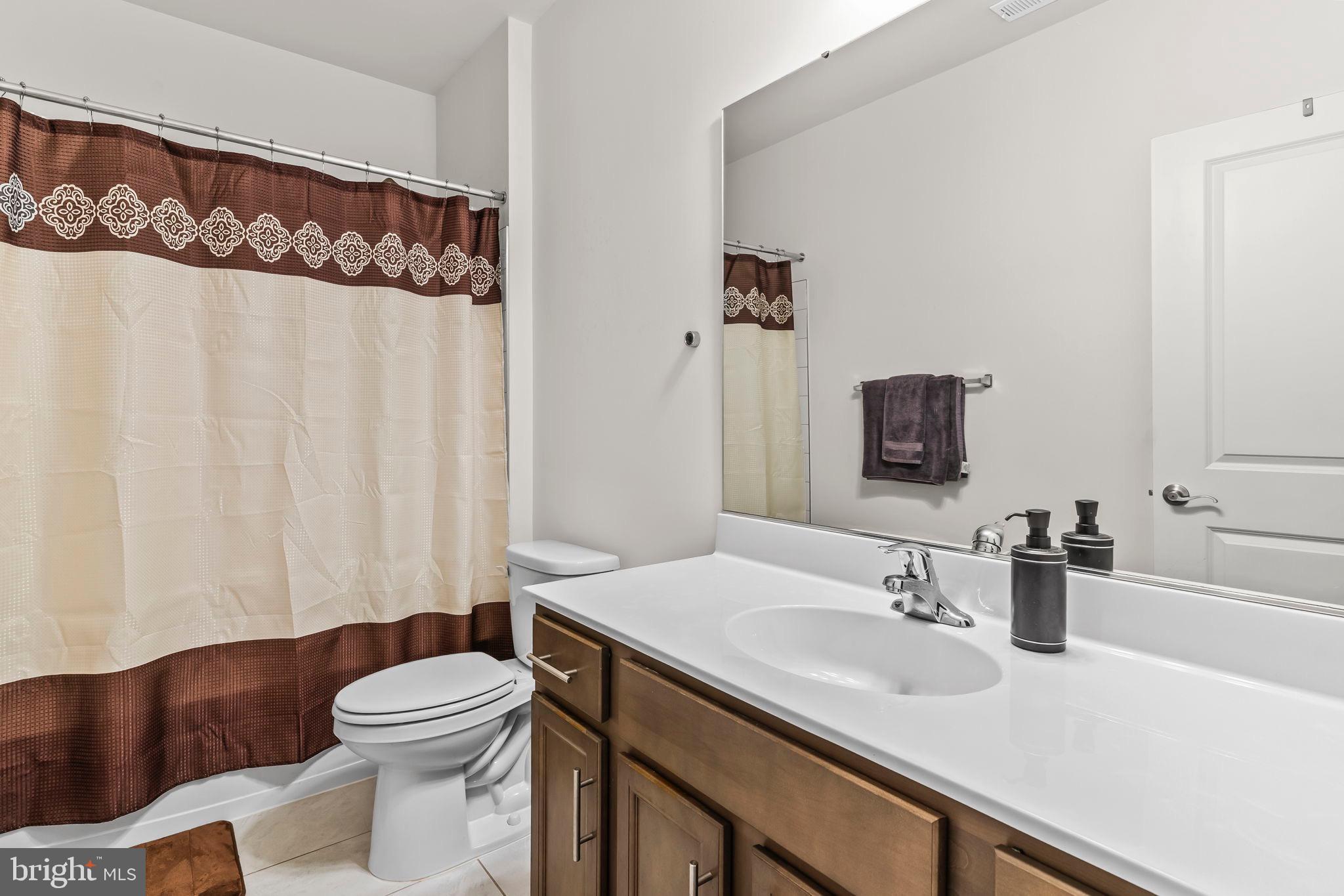 9104 Rama Court Clinton, MD 20735 - Photo 53 of 62 Modern basement bathroom with elegant accents.
