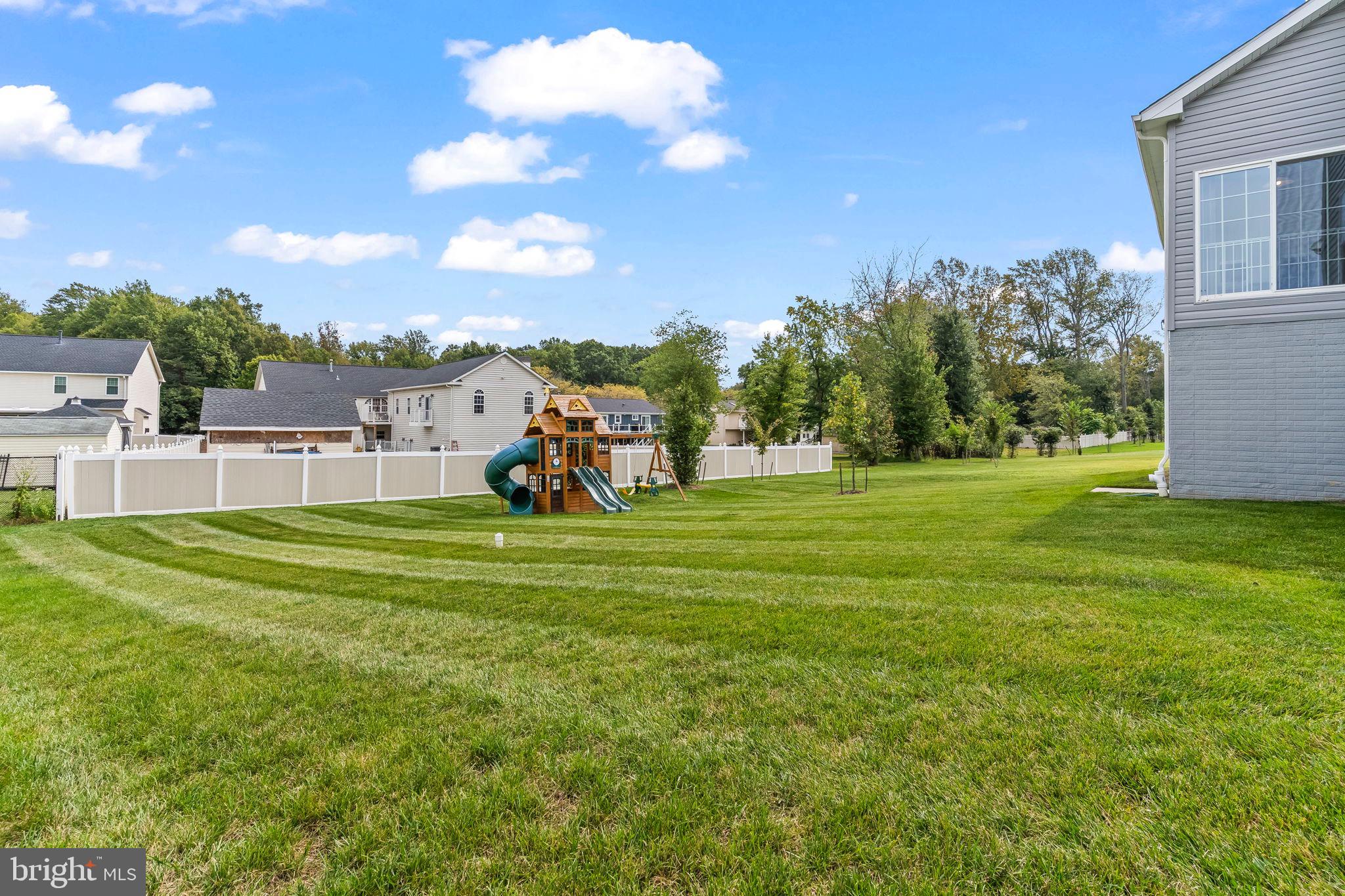 9104 Rama Court Clinton, MD 20735 - Photo 57 of 62 Spacious yard with playground and blue skies.