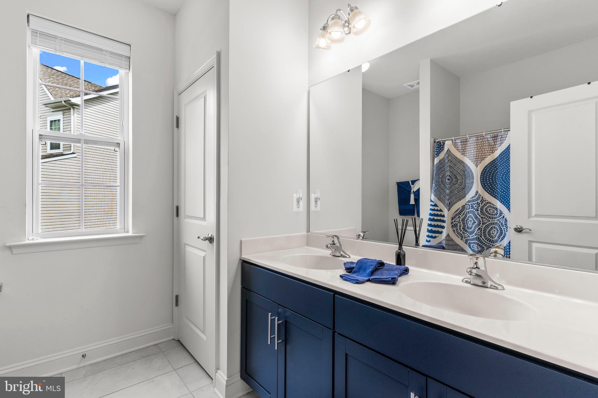9104 Rama Court Clinton, MD 20735 - Photo 9 of 62 Bright and modern bathroom with stylish accents.