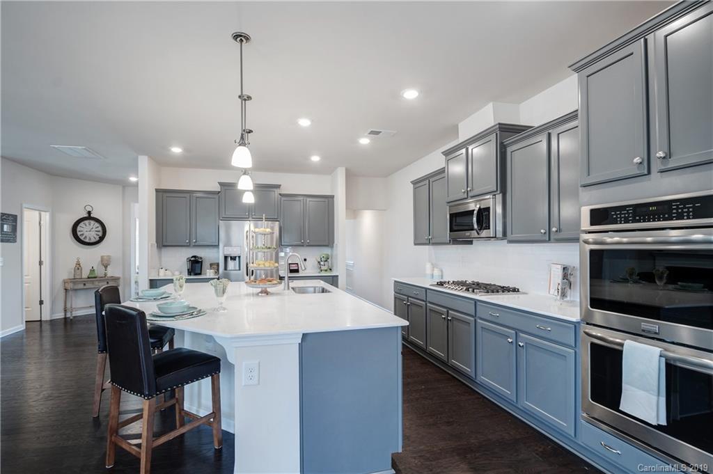 1014 Bannister Road Waxhaw, NC 28173 - Photo 13 of 48 a large kitchen with a sink and cabinets