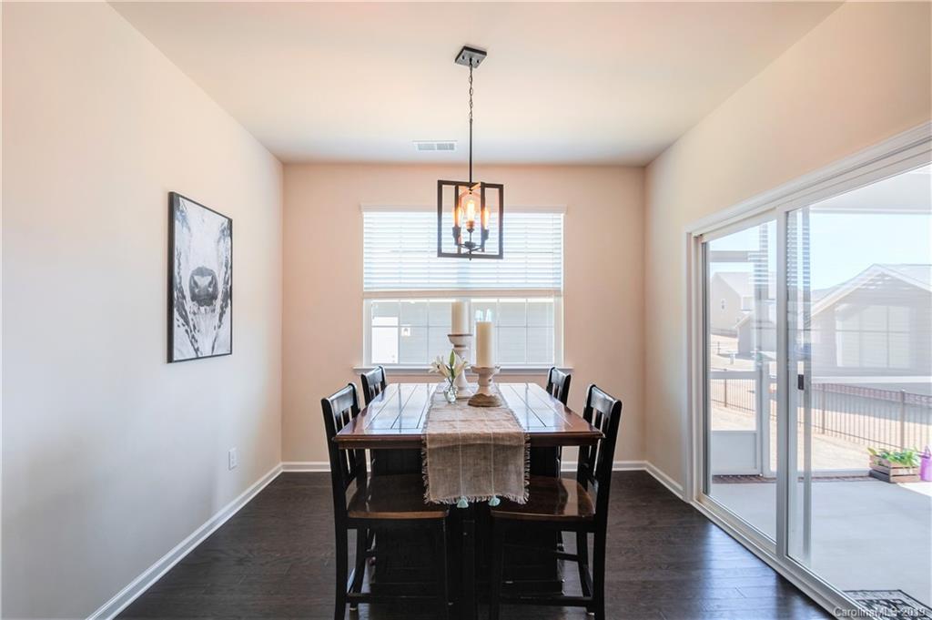 1014 Bannister Road Waxhaw, NC 28173 - Photo 17 of 48 a dining room with furniture window wooden floor