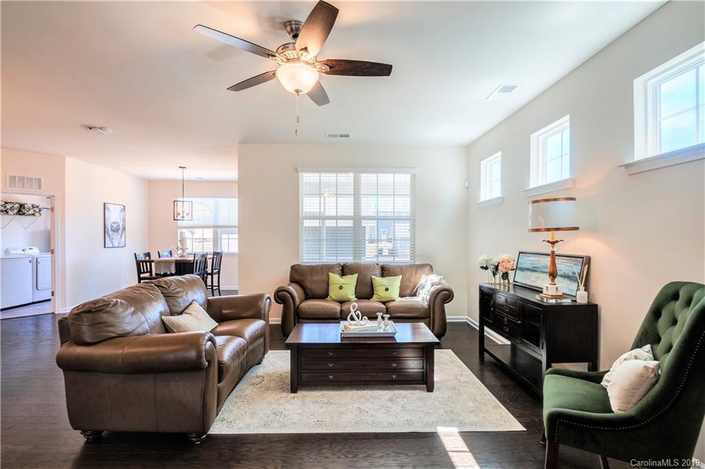 1014 Bannister Road Waxhaw, NC 28173 - Photo 19 of 48 a living room with furniture ceiling fan and a window