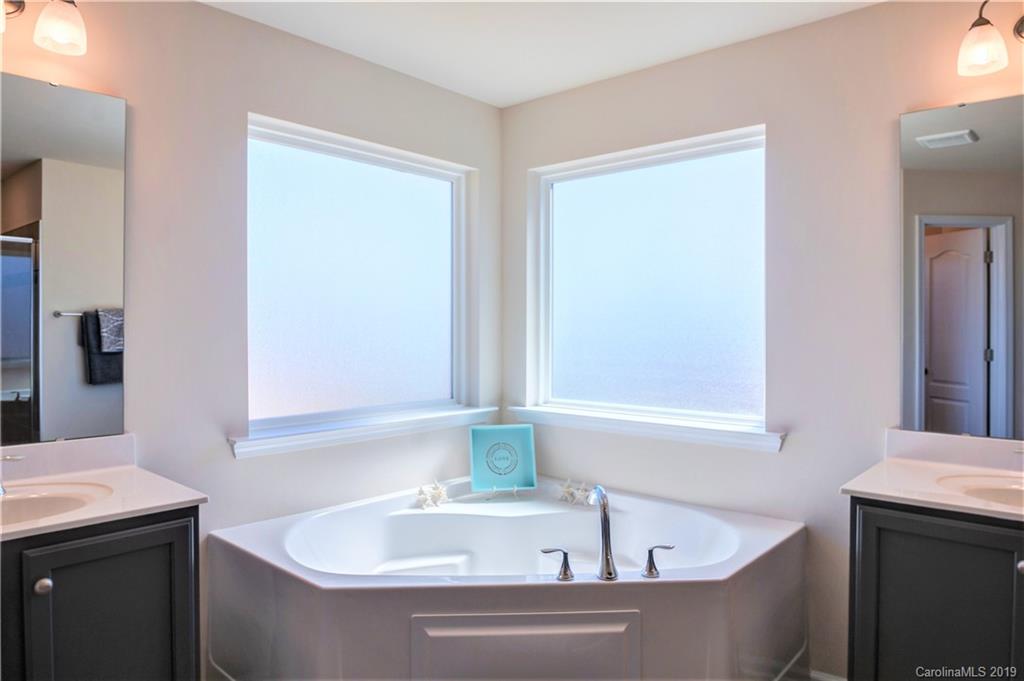 1014 Bannister Road Waxhaw, NC 28173 - Photo 26 of 48 a bathroom with a bathtub and a sink