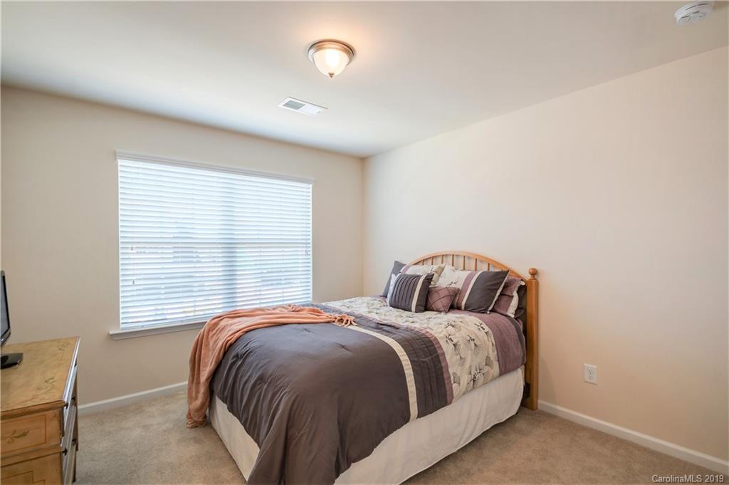 1014 Bannister Road Waxhaw, NC 28173 - Photo 28 of 48 a bedroom with a bed and a window