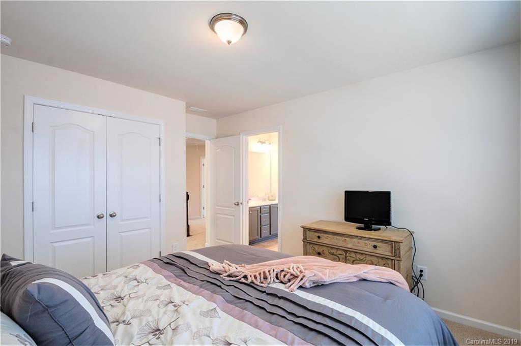1014 Bannister Road Waxhaw, NC 28173 - Photo 29 of 48 a bedroom with a bed and a tv