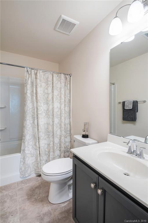 1014 Bannister Road Waxhaw, NC 28173 - Photo 33 of 48 a bathroom with a sink a toilet and shower
