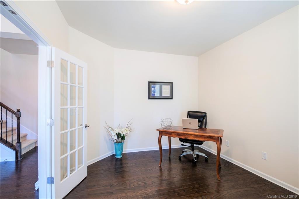 1014 Bannister Road Waxhaw, NC 28173 - Photo 6 of 48 a view of a workspace with furniture and wooden floor