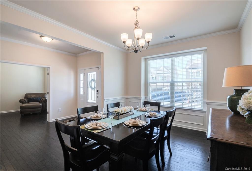 1014 Bannister Road Waxhaw, NC 28173 - Photo 7 of 48 a view of a dining room with furniture window and wooden floor