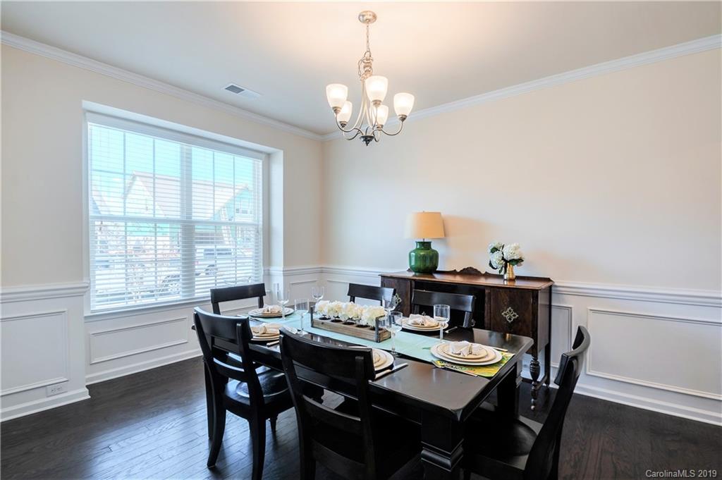 1014 Bannister Road Waxhaw, NC 28173 - Photo 8 of 48 a view of a dining room with furniture window and wooden floor