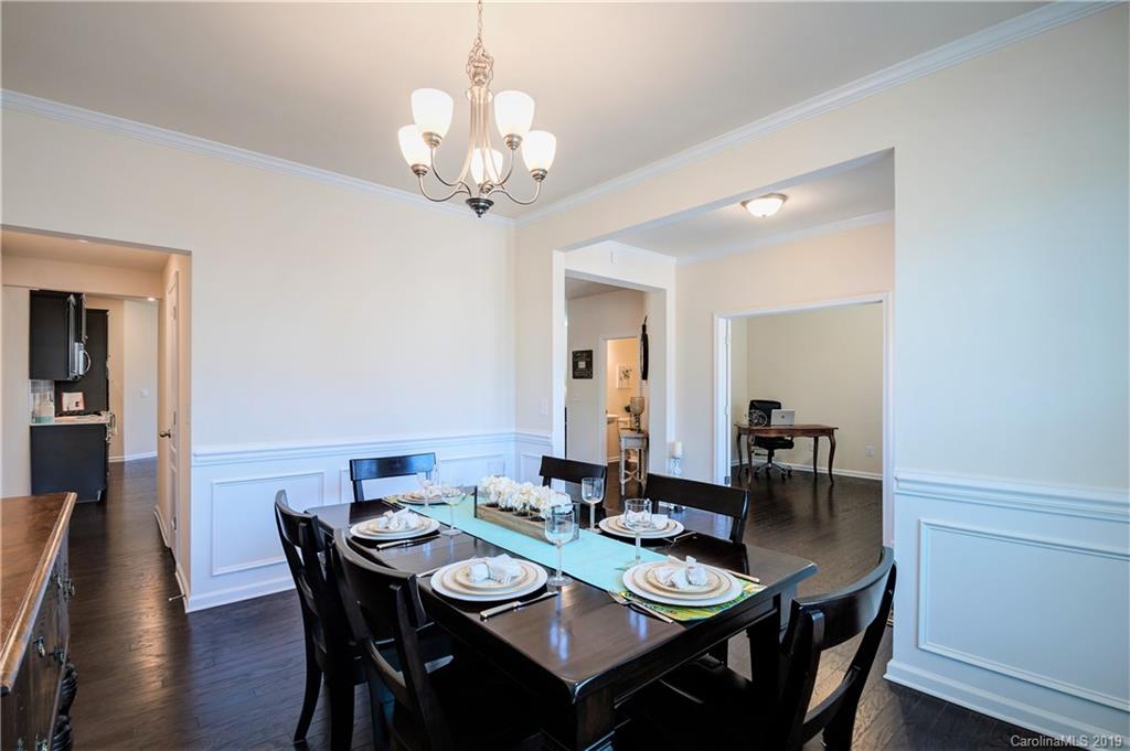 1014 Bannister Road Waxhaw, NC 28173 - Photo 9 of 48 a view of a dining room with furniture and wooden floor