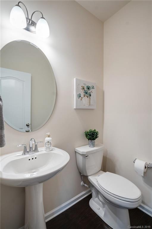 1014 Bannister Road Waxhaw, NC 28173 - Photo 10 of 48 a bathroom with a toilet sink and mirror