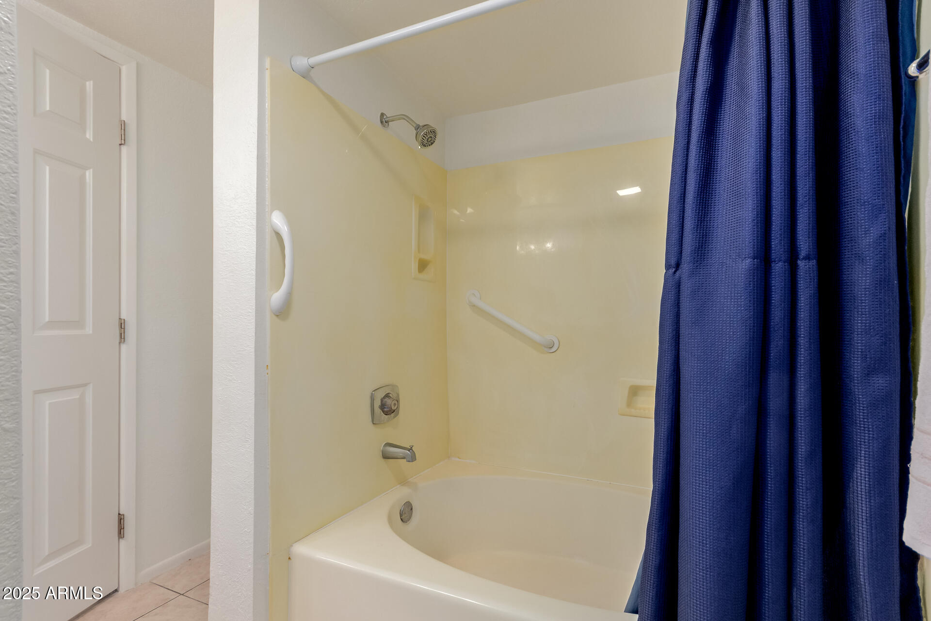 1340 North Recker Road, Unit 133 Mesa, AZ 85205 - Photo 12 of 17 a bathroom with a bathtub and shower