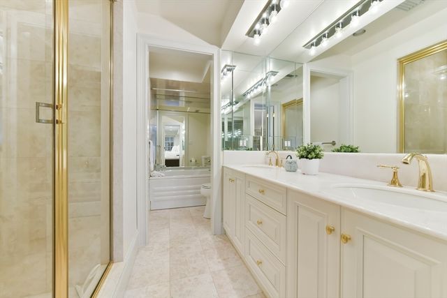 a bathroom with a double vanity sink and mirror