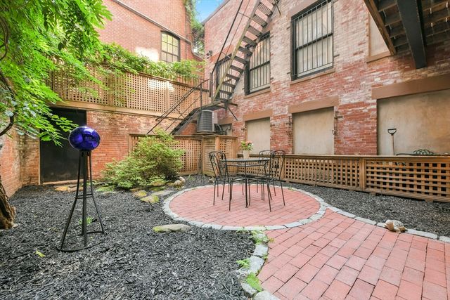 a view of a backyard with a patio