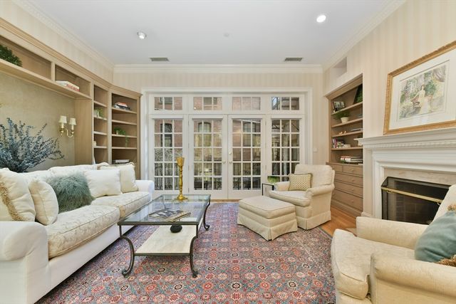 a living room with furniture or couch and a fireplace