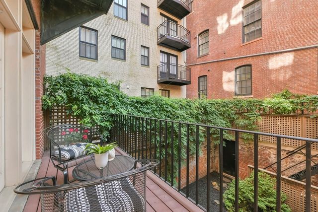 a balcony view with an outdoor seating space