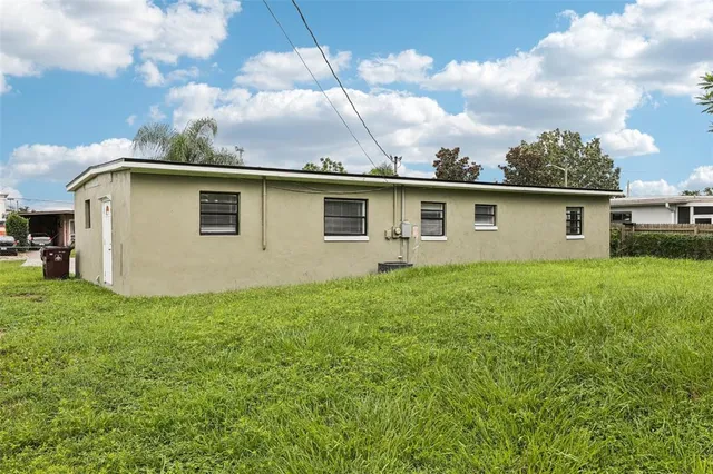a view of a backyard with plants and a garden