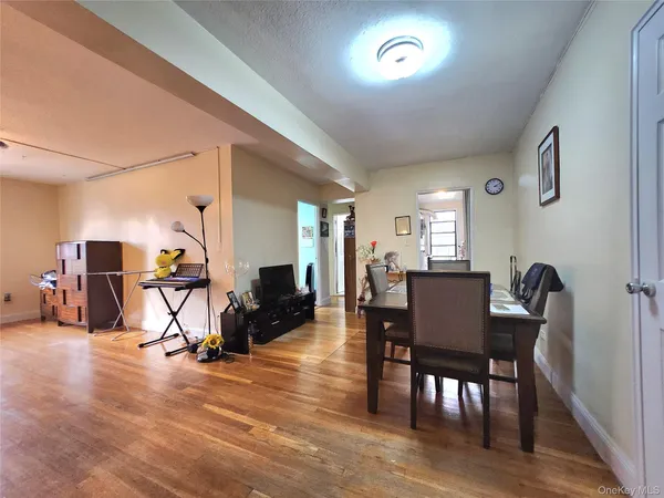 a view of a dining room with furniture and a window