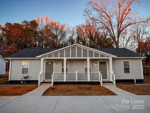 a front view of a house with yard