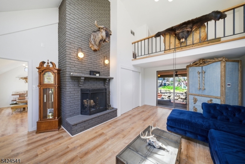 7 Pathfinder Trail Wharton, NJ 07885 - Photo 13 of 46 a living room with furniture a fireplace and a window