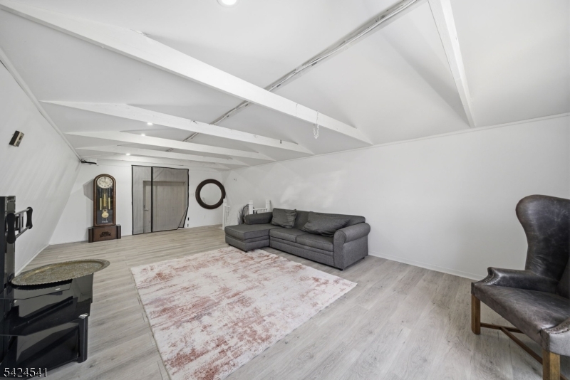 7 Pathfinder Trail Wharton, NJ 07885 - Photo 33 of 46 a spacious bedroom with a bed and a chair