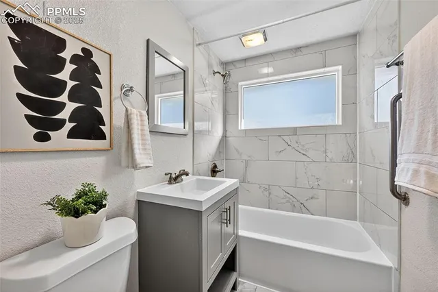 a bathroom with a sink and a bathtub