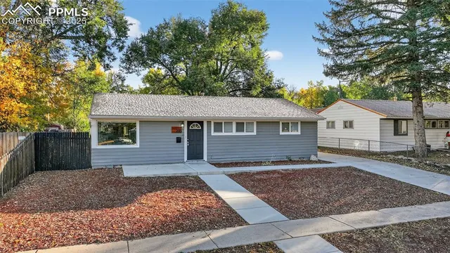 front view of a house with a yard
