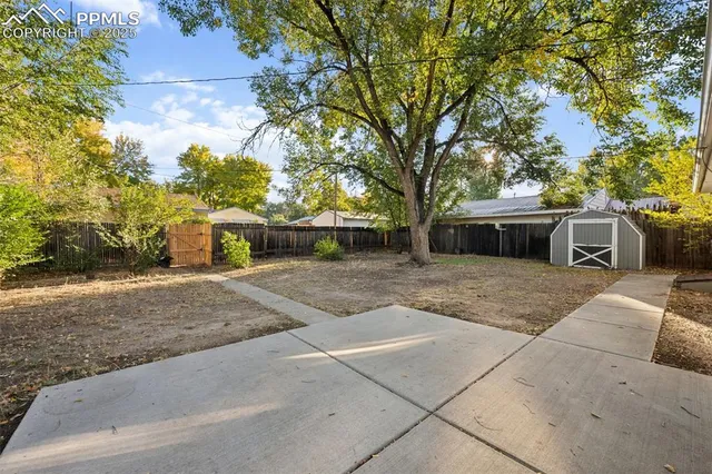 a front view of a house with a yard and a garage