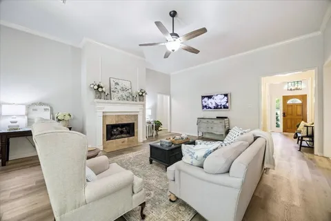 a living room with furniture and a fireplace