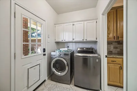 a kitchen with a stove top oven sink and cabinets