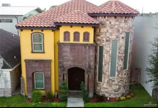 a front view of a house with yard