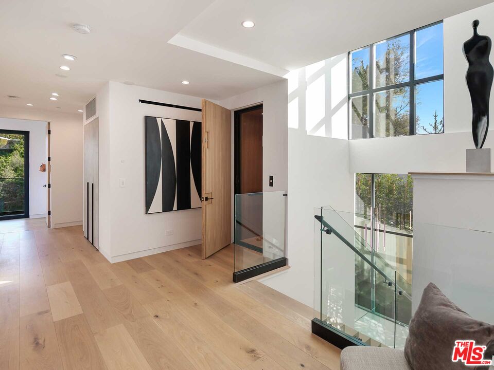 1324 Stradella Road Los Angeles, CA 90077 - Photo 14 of 26 a view of entryway with a window and stairs