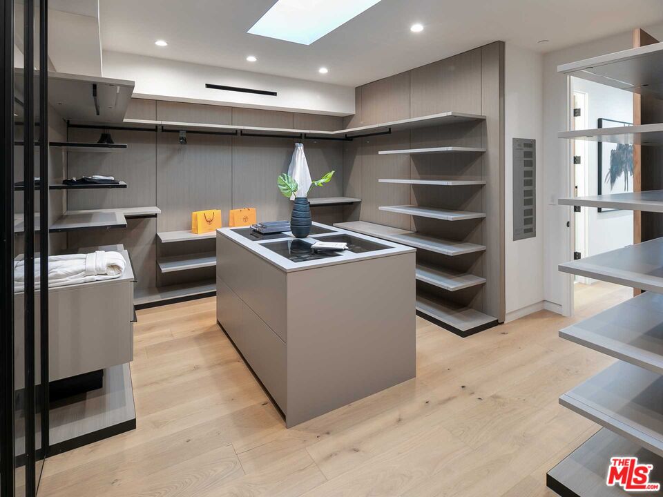 1324 Stradella Road Los Angeles, CA 90077 - Photo 19 of 26 a kitchen with stainless steel appliances a stove and a refrigerator