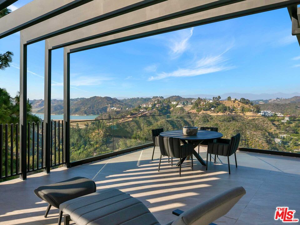 1324 Stradella Road Los Angeles, CA 90077 - Photo 20 of 26 a view of a chairs and table in patio