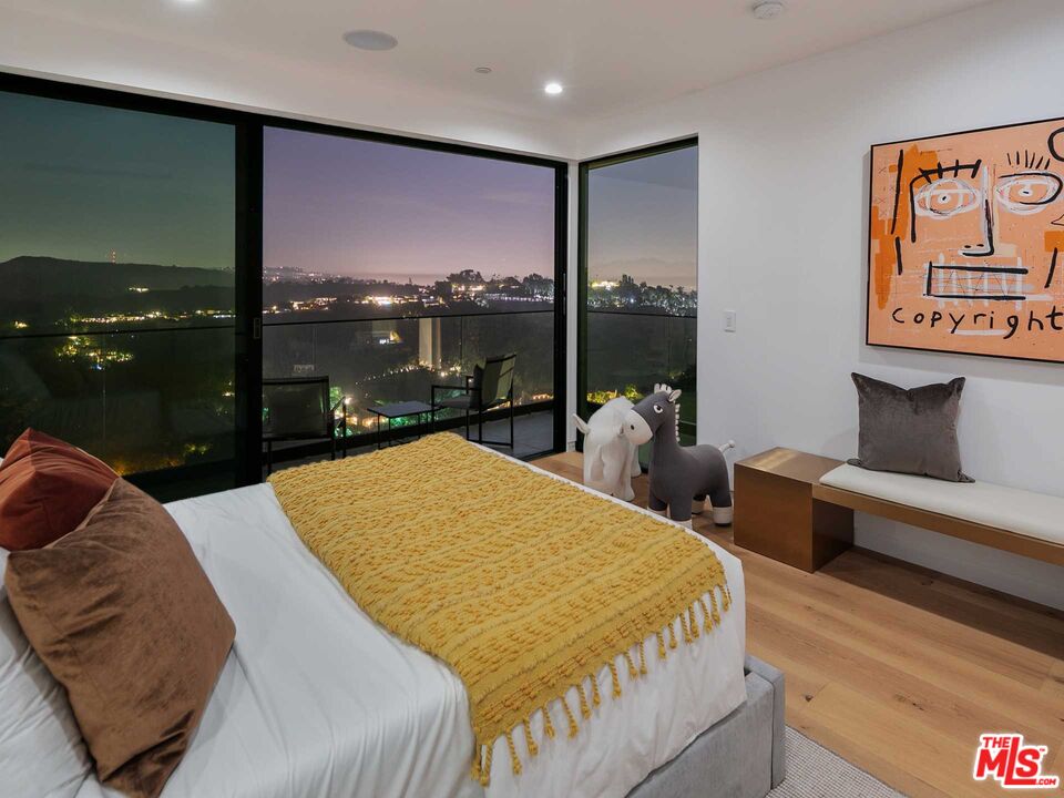 1324 Stradella Road Los Angeles, CA 90077 - Photo 22 of 26 a bed sitting in a bedroom and balcony