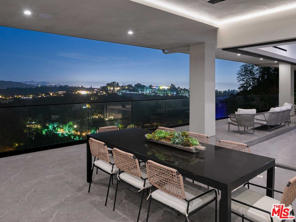 1324 Stradella Road Los Angeles, CA 90077 - Photo 26 of 26 a view of a terrace with furniture and garden view